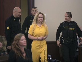 In this Nov. 18, 2016 file photo, Alexandria Duval walks into Albany County Court in Albany, N.Y. A murder trial is underway for Duval, accused of deliberately driving off a cliff in Hawaii and killing her identical twin sister.