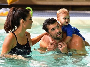 Nicole Phelps, Michael Phelps and Boomer Phelps attend the Huggies Little Swimmers #trainingfor2032 Swim Class With The Phelps Foundation on Aug. 21, 2017