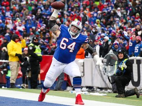 Richie Incognito of the Buffalo Bills spikes the ball during the first quarter against the Miami Dolphins on Dec. 17, 2017