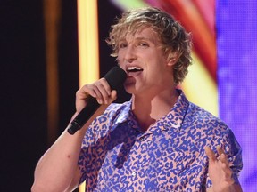 In this Aug. 13, 2017, file photo, Logan Paul introduces a performance by Kyle & Lil Yachty and Rita Ora at the Teen Choice Awards at the Galen Center in Los Angeles. YouTube says it has removed blogger Logan Paul's channels from Google Preferred and will not feature him in the new season of "Foursome." Paul's new video blogs also are on hold after he shared a video on YouTube that appeared to show a body hanging in a Japanese forest that is said to be a suicide spot.
