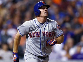 In this Aug. 1, 2017, file photo, New York Mets' Jay Bruce watches his solo home run during a game in Denver.