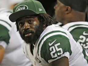 In this Nov. 18, 2012, file photo, New York Jets' Joe McKnight (25) sits on the sideline during the fourth quarter of an NFL football game against the St. Louis Rams in St. Louis. Closing argument are expected Friday, Jan. 26, 2018 in the murder trial of Ronald Gasser, who is accused of killing Knight in a road rage incident.