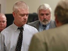 In this March 26, 2014, file photo, Craig Michael Wood, left, enters the courtroom for a hearing in Springfield, Mo. Wood is charged with first-degree murder, armed criminal action, child kidnapping, rape and sodomy in connection with 10-year-old Hailey Owens' death in February of 2014.