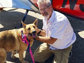 This June 6, 2016, photo provided by Best Fur Friends Rescue, shows Dr. Bill Kinsinger, with Jojo, a dog from Fort Worth Animal Care & Control, at a regional airport in northern Illinois.