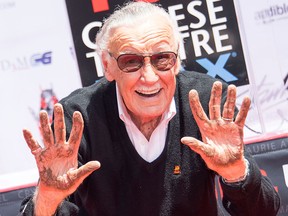 Stan Lee places his hands in cement during his hand and footprint ceremony at TCL Chinese Theatre IMAX, on July 18, 2017, in Hollywood, Calif. (VALERIE MACON/AFP/Getty Images)