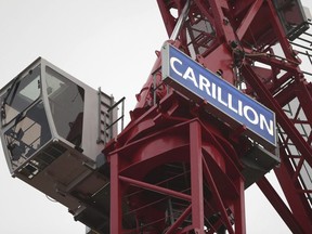 A crane bearing the name of Carillion, at a construction site in central London, Monday Jan. 15, 2018, as the construction and services giant Carillion has gone into liquidation.  In a statement released Monday, Carillion says it had no choice but to go into liquidation after weekend talks with creditors and government officials failed.