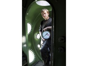 In this April 30, 2008 file photo, submarine owner Peter Madsen stands inside the vessel. A Danish prosecutor said Tuesday Jan. 16, 2018  that inventor Peter Madsen has been charged with murdering Swedish journalist Kim Wall during a trip on his private submarine, saying he either cut her throat or strangled her. Prosecutor Jakob Buch-Jepsen said Tuesday the case is "very unusual and extremely gross."