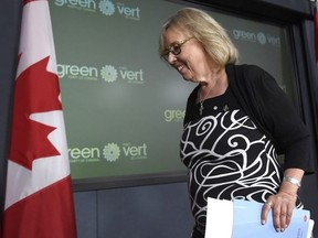 Green Party Leader Elizabeth May leaves the stage after making an announcement at the National Press Theatre, in Ottawa on Monday, August 22, 2016.