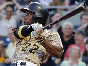 In this Aug. 3, 2017, file photo, Pittsburgh Pirates' Andrew McCutchen watches his RBI-single during a game in Pittsburgh. (AP Photo/Gene J. Puskar, File)