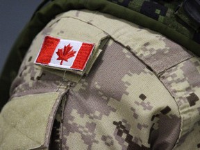 A Canadian flag patch is shown on a soldier's shoulder in Trenton, Ont., on Thursday, Oct. 16, 2014.