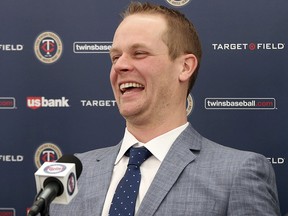 Former Minnesota Twins player Justin Morneau enjoys a light moment during his retirement announcement Wednesday, Jan. 17, 2018 in Minneapolis. (AP Photo/Jim Mone)