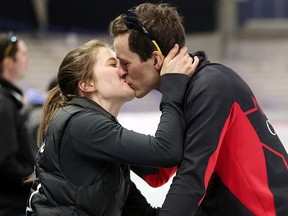Denny Morrison kisses his wife Josie after qualifying for the Winter Games at the speed skating Olympic trials in Calgary on Saturday January 6, 2018.