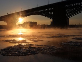 Steam rises above the waters of the Mississippi River underneath the Eads Bridge as the temperature hovers around -1 degrees Fahrenheit on Tuesday, Jan. 2, 2018, in St. Louis. Cold temperatures will stay throughout the week.