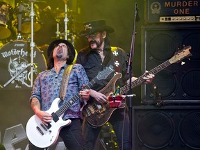 Motorhead's lead singer Ian "Lemmy" Kilmister (R) and lead guitarist Phil Campbell perform with the band on the Pyramid Stage on the first official date of the Glastonbury Festival of Music and Performing Arts on Worthy Farm near the village of Pilton in Somerset, south west England, in this June 26, 2015 file photo. (OLI SCARFF/AFP/Getty Images)