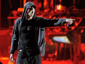 FILE - In this April 15, 2012, file photo, Eminem performs at the 2012 Coachella Valley Music and Arts Festival in Indio, Calif. A New Zealand court ordered on Wednesday, Oct. 25, 2017, the nation's main conservative political National Party to pay Eminem's publisher 600,000 New Zealand dollars ($415,000) plus interest for breaching copyright by using a song similar to Eminem's "Lose Yourself" in its campaign ads. The party used the song "Eminem Esque" 186 times during its successful 2014 election campaign before pulling the ad off the air. Publisher Eight Mile Style sued, saying the track was a rip-off of the rapper's acclaimed 2002 hit.
