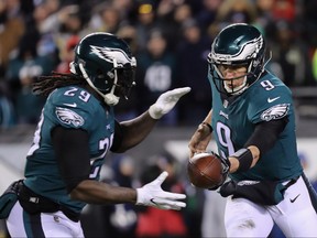 Nick Foles #9 of the Philadelphia Eagles hands the ball off to LeGarrette Blount #29 against the Atlanta Falcons during the second quarter in the NFC Divisional Playoff game at Lincoln Financial Field on January 13, 2018 in Philadelphia, Pennsylvania. (Abbie Parr/Getty Images)