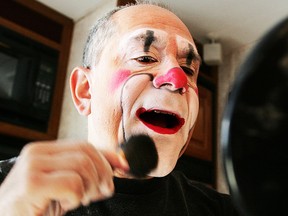 In this Dec. 1, 2005, file photo, Barry Lubin, star of the Big Apple Circus' "Grandma Goes to Hollywood," applies powder after applying his clown makeup in his trailer at Damrosch Park in New York's Lincoln Center. (AP Photo/Kathy Willens, File)