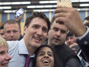 Prime Minister Justin Trudeau works his way through the crowd at a town hall meeting in Lower Sackville, N.S. on Tuesday, Jan. 9, 2018.