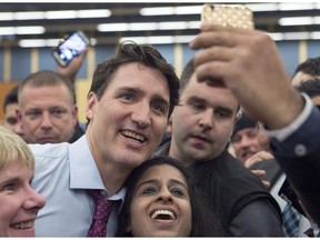 Prime Minister Justin Trudeau works his way through the crowd at a town hall meeting in Lower Sackville, N.S. on Tuesday, Jan. 9, 2018.