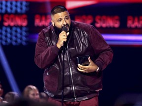 In this Sunday, Nov. 19, 2017, file photo, DJ Khaled accepts the award for favorite song rap/hip-hop for "I'm the One" at the American Music Awards at the Microsoft Theater in Los Angeles.