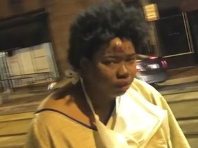 This Tuesday, Jan. 9, 2018, file still image taken from video provided by Imamu Baraka shows a woman discharged from a Baltimore hospital wearing only a gown and socks on a cold winter's night. An attorney for a woman who was left outside a Baltimore hospital wearing a patient gown and socks on a frigid night says she was having a psychotic episode when the institution turned its back on her. Hospital officials say they are still investigating why the woman was escorted out of the hospital by uniformed security personnel and left at a city bus stop.
