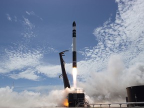 In this photo provided by Rocket Lab, Electron rocket carrying only a small payload of about 150 kilograms (331 pounds), lifts off from the Mahia Peninsula on New Zealand's North Island's east coast. (Rocket Lab via AP)