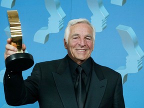 Donnelly Rhodes of Da Vinci's Inquest holds his trophy after winning for best actor in a leading dramatic role at the 17th Annual Gemini Awards in Toronto on Nov. 4, 2002. THE CANADIAN PRESS/Kevin Frayer