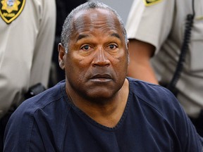 In this May 14, 2013 pool file photo, O.J. Simpson sits during a break on the second day of an evidentiary hearing in Clark County District Court in Las Vegas.  (AP Photo/Ethan Miller, Pool, File)