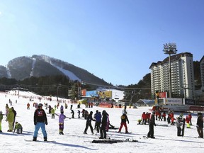 In this Dec. 19, 2017, photo, people take to the slopes at Yongpyong Resort in Pyeongchang, South Korea. South Korea is one of the safest places in the world to live and visit. The Pyeongchang Olympics are coming to a remote, ruggedly beautiful part of South Korea known for icy wind, towering granite mountains and a tough, proud population waiting to welcome foreign hordes.