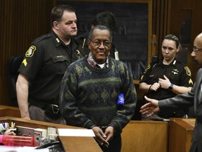 Wayne County Sheriff's deputies bring Leroy Moon into the courtroom of Judge Cynthia Hathaway on Wednesday, Jan. 31, 2018 in Detroit.  Moon has been sentenced to a year in jail for fatally shooting another man in the back, six years after his manslaughter conviction.  Moon pleaded no contest in 2011, but he wasn't sentenced until Wednesday. The prosecutor's office says it lost track. The judge says she's still not certain what happened.    (Daniel Mears/Detroit News via AP) ORG XMIT: MIDTN101