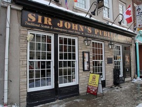 Sir John's Public House in Kingston on Tuesday January 9, 2018 before new signs were placed on the walls.
