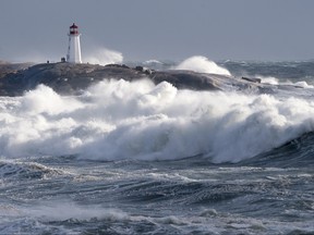 Waves pound the shore at Peggy's Cove, N.S. on Friday, Jan. 5, 2018. A winter storm hit Nova Scotia, New Brunswick, P.E.I. and parts of Newfoundland and Labrador, with wind, rain and heavy snow in places. THE CANADIAN PRESS/Andrew Vaughan
