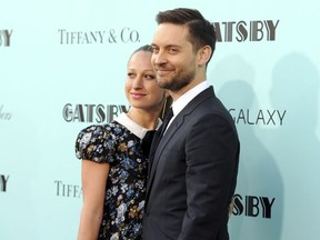 FILE - In this May 1, 2013, file photo, actor Tobey Maguire, right, and wife Jennifer Meyer attend "The Great Gatsby" world premiere in New York. A representative for Maguire confirmed a People magazine report on Oct. 18, 2016, that Maguire and Meyer have separated after nine years of marriage.