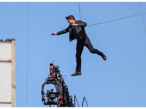 Tom Cruise jumps between two building in a scene from the new Mission Impossible film.