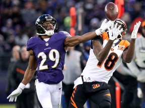 Wide Receiver A.J. Green of the Cincinnati Bengals catches a pass while defended by defensive back Marlon Humphrey of the Baltimore Ravens in the first quarter on Dec. 31, 2017