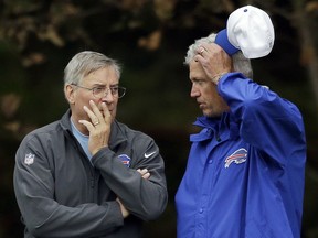 In this Oct. 22, 2015, file photo, Buffalo Bills head coach Rex Ryan, right, talks with team owner Terry Pegula during an NFL training session at the Grove Hotel in Chandler's Cross, England. (AP Photo/Matt Dunham, File)