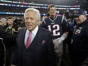 New England Patriots owner Robert Kraft and quarterback Tom Brady (12) leave the field after winning the AFC championship NFL football game against the Jacksonville Jaguars, Sunday, Jan. 21, 2018, in Foxborough, Mass. (AP Photo/Charles Krupa)