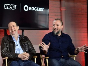 Vice co-founder and CEO Shane Smith (right) gestures as Rogers Communications President and CEO Guy Laurence laughs during an announcement in Toronto on Thursday October 30, 2014.
