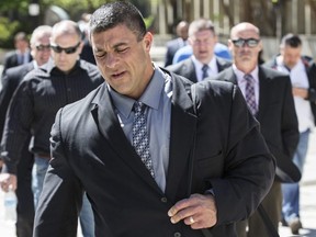 Det.-Const. Remo Romano leaves 361 University Ave. courthouse after a mistrial was declared in his trial on Wednesday May 18, 2016. Craig Robertson/Toronto Sun/Postmedia Network