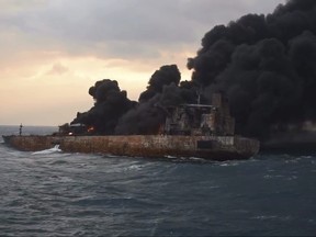 In this Thursday, Jan. 11, 2018, photo provided by China's Ministry of Transport, smoke rises from a fire aboard the oil tanker Sanchi in the East China Sea off the eastern coast of China.