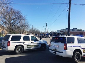 Law enforcement personnel from the Ellis County Sheriff's Office park outside the high school in Italy, Texas, following an active shooter incident at the school Monday morning, Jan. 22, 2018.