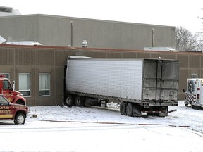 A semitrailer is embedded in the side of Lyle Public School Tuesday morning, Jan. 16, 2018 after it veered off a highway and crashed through the wall of the elementary school in Lyle, Minnesota.