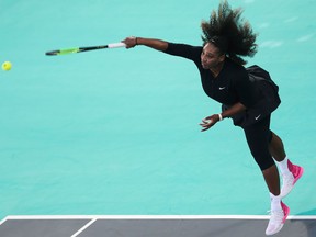 Serena Williams serves the ball to Jelena Ostapenko during the final day of the Mubadala World Tennis Championship on Dec. 30, 2017