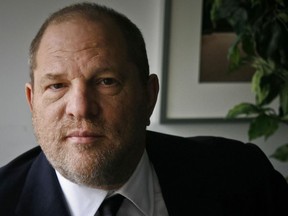 In this Nov. 23, 2011 file photo, film producer Harvey Weinstein poses for a photo in New York. A lawyer for Weinstein called actress Rose McGowan's claims of rape against the former Hollywood producer are "a bold lie."
