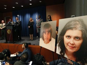 Riverside County District Attorney Mike Hestrin, at podium, takes questions from the media at a news conference regarding the couple accused of starving and torturing their 13 children in Riverside, Calif., Thursday, Jan. 18, 2018.