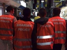 Members of a self-proclaimed 'Sharia police' group patrol the streets of Wuppertal, Germany.