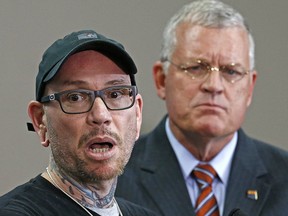 In this Jan. 24, 2017 file photo, Thomas Yoxall, left, explains the events of how he killed Leonard Pennelas-Escobar, a suspect who was beating Arizona state trooper Edward Andersson as Department of Public Safety Director Frank Milstead looks on during a news conference at DPS headquarters in Phoenix. (AP Photo/Ross D. Franklin, File)