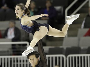 In this Jan. 4, 2018, file photo, Marissa Castelli, top, and Mervin Tran perform during the pairs short program at the U.S. Figure Skating Championships in San Jose, Calif. (AP Photo/Marcio Jose Sanchez, file)