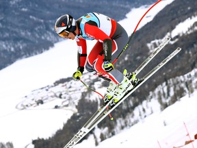 Canada's Erik Guay is airborne during a men's super-G, at the alpine ski World Championships, in St. Moritz, Switzerland, on Feb. 8, 2017