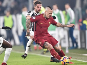 Juventus' Miralem Pjanic and Roma's Radja Nainggolan, foreground, vie for the ball during the Italian Serie A soccer match on Dec. 23, 2017